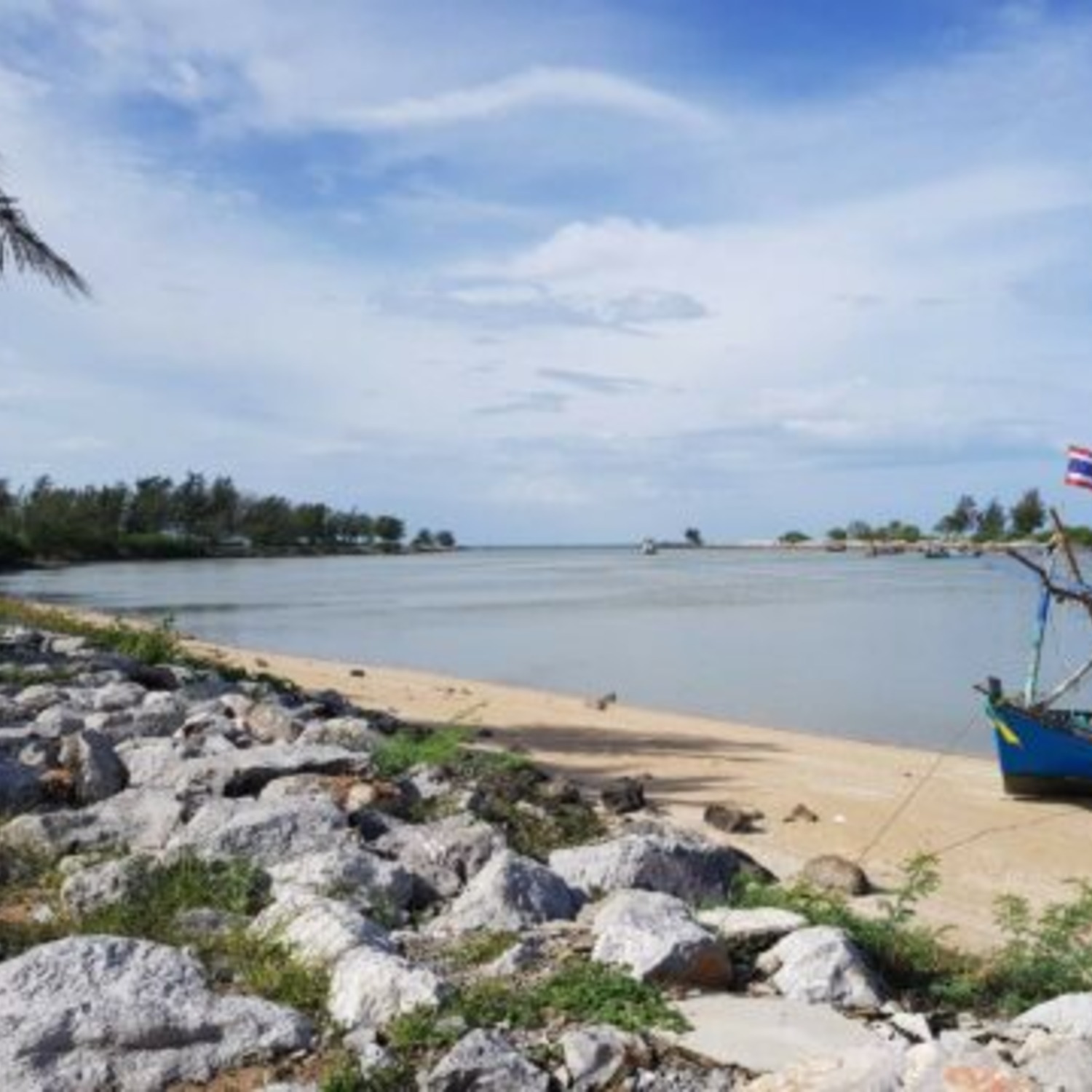 The quiet shoreline and fishing boats near the Pranburi river mouth close to Lyndale Lodge